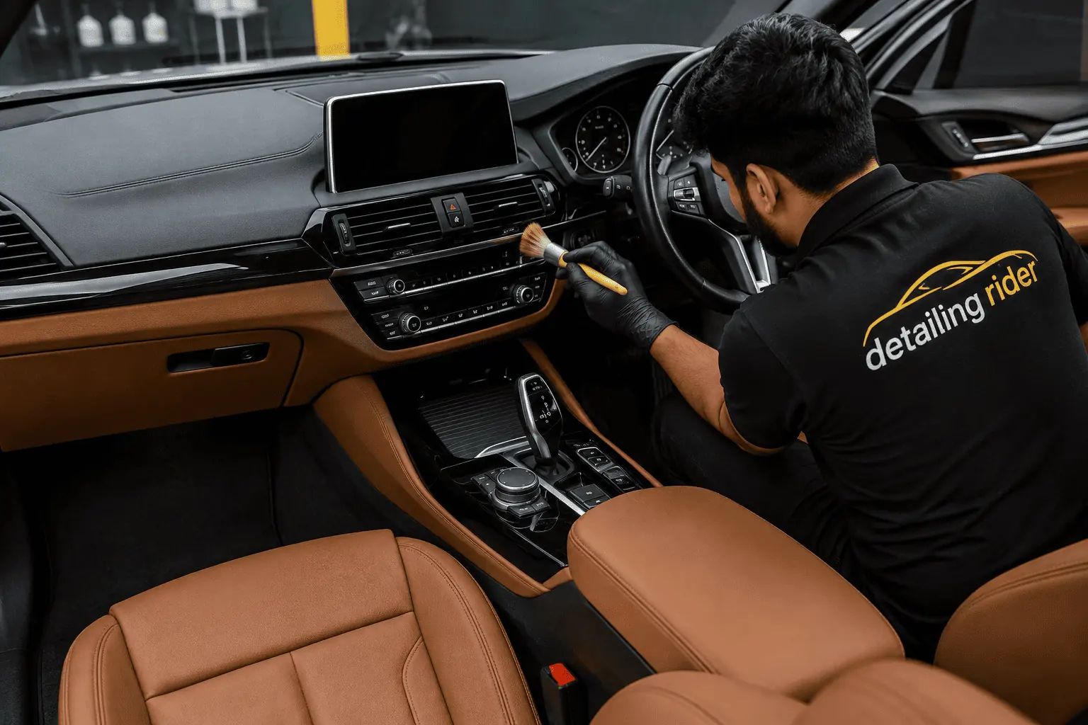 Brown leather seats being cleaned during an interior detail